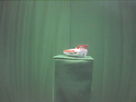 270 Degrees _ Picture 9 _ Red and White Toy Speedboat.png